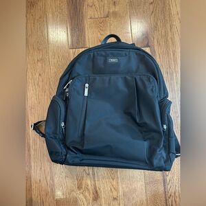 Tumi Black Backpack with Multiple Zip Pockets
